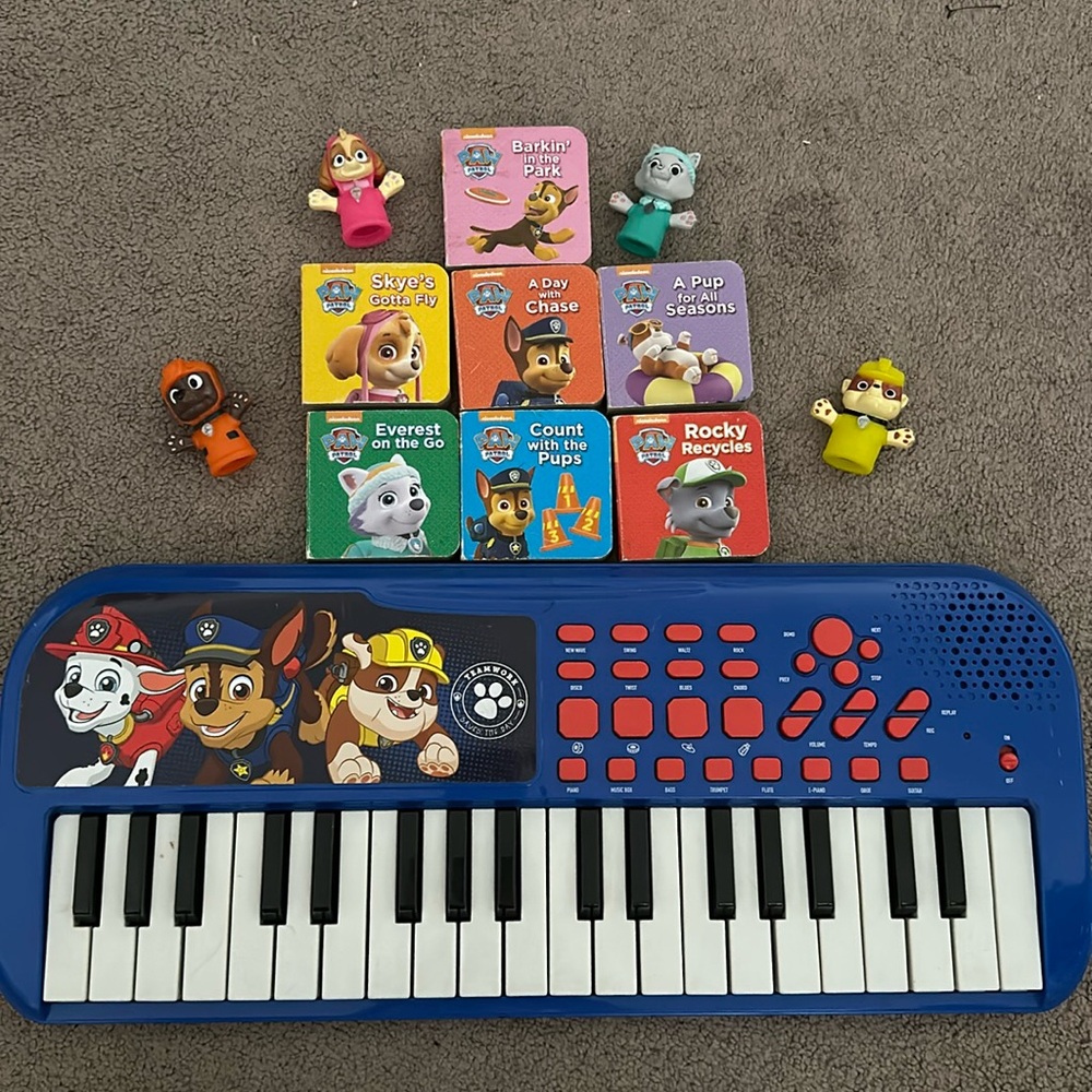 Paw Patrol bundle of books, piano, and finger puppets